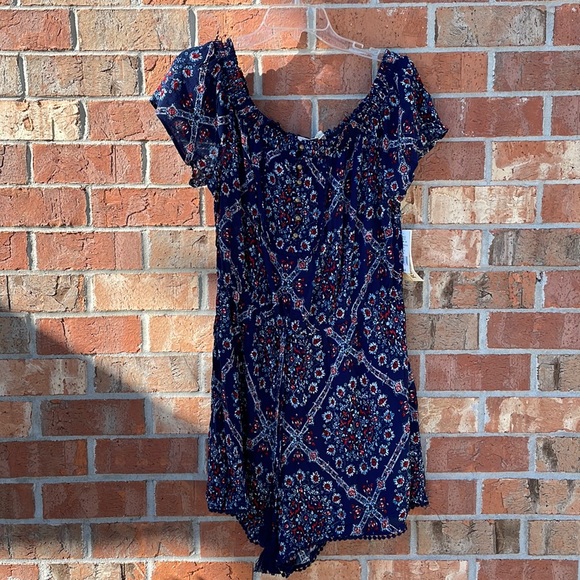 A Rewind Woman’s NWT Romper Size Xl Blue Red Floral with Pom Pom trim on hem - Picture 1 of 9